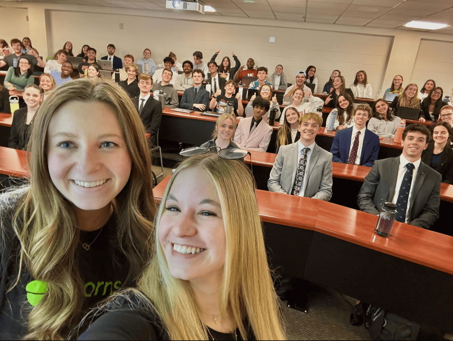Student ambassadors in front of a full lecture hall